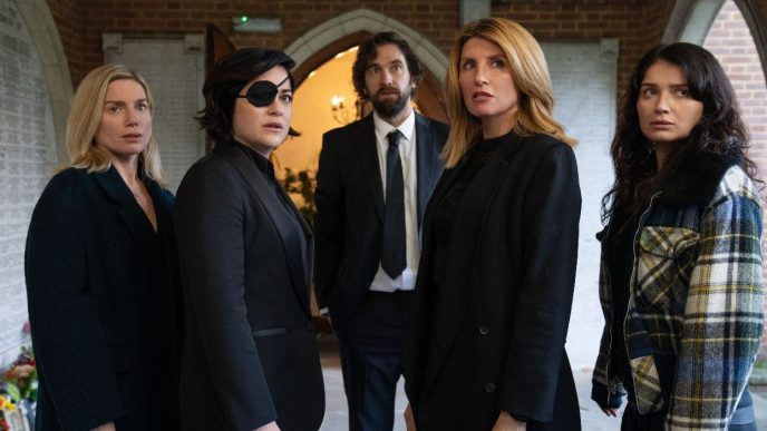 Eva Birthistle, Sarah Greene, Sharon Horgan, and Eve Hewson standing in a church