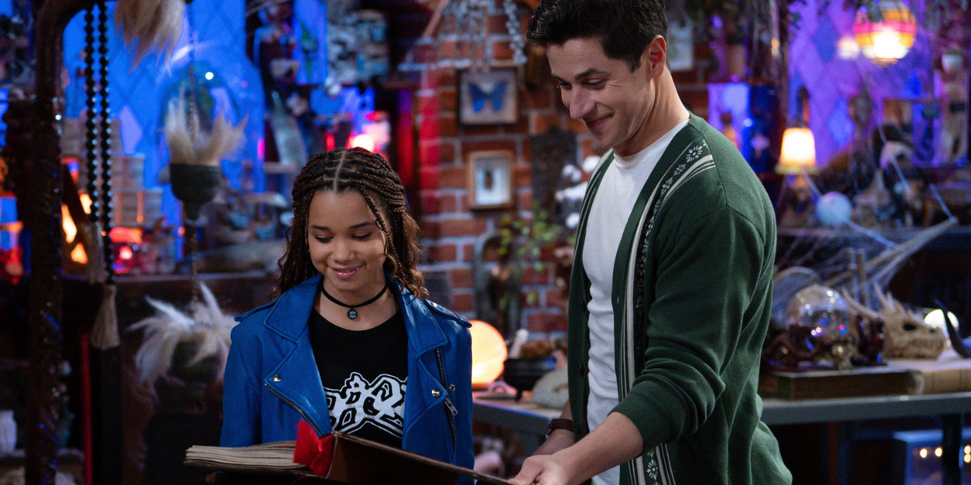 David Henrie standing in front of a spellbook as Justin Russo in Wizards beyond waverly place