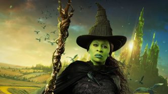 Cynthia Erivo as Elphaba wearing her witches outfit while walking away from the emerald city.