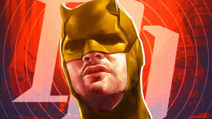 Charlie Cox as Daredevil in his yellow suit with the logo behind him