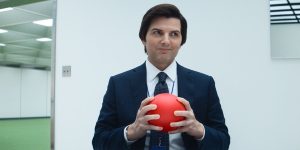 Mark (Adam Scott) smiling and holding a red ball in Severance Season 2