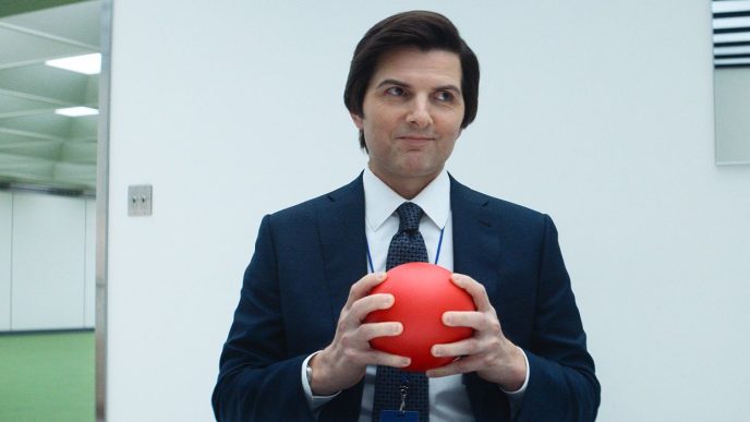 Mark (Adam Scott) smiling and holding a red ball in Severance Season 2