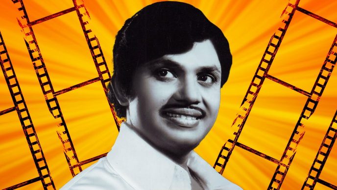 Actor and stuntman Jayan in black and white, standing against an orange background of film reels.