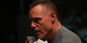 Jason Beghe as Voight holding a rag to his mouth in Chicago PD Season 12